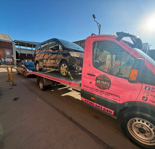 red car being recovered outside