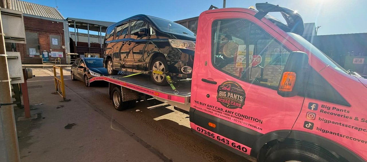 red car being recovered outside