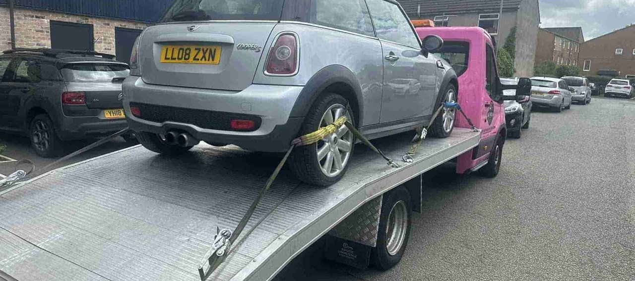white car on a truck